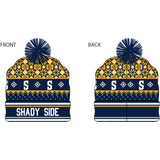 A custom knit Nordic beanie in blue and gold with a pom-pom, featuring the text 'Shady Side' on the front.